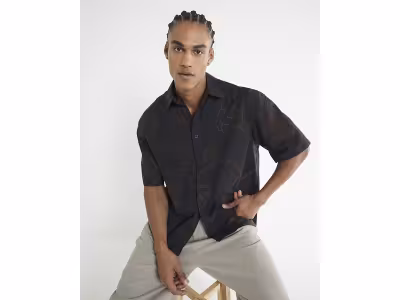 Chemise noire oversize à broderies en corde